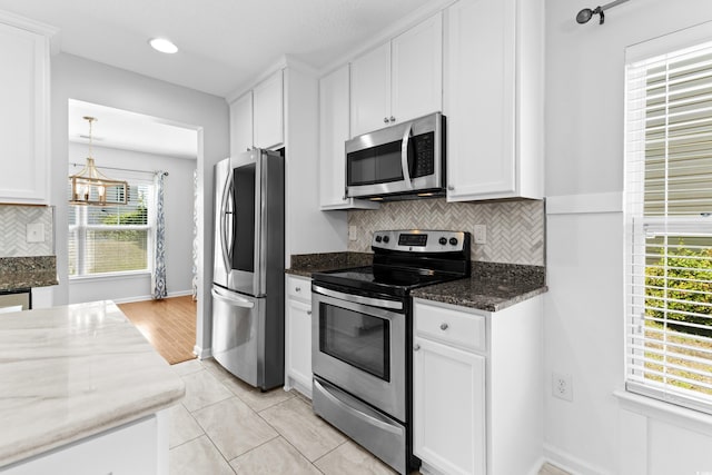 356 Whipple Run Loop, Myrtle Beach, SC 29588 - kitchen with stainless steel appliances, white cabinetry, decorative backsplash, dark stone countertops, and recessed lighting