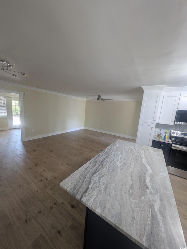 880 Briarwood Dr, Myrtle Beach, SC 29572 - kitchen featuring stainless steel appliances, open floor plan, crown molding, white cabinets, and light wood finished floors