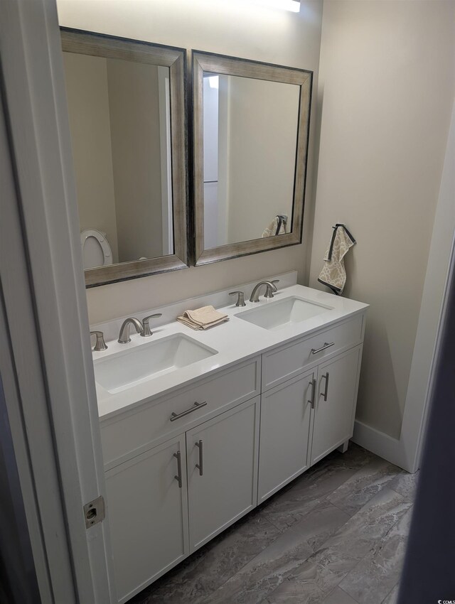 880 Briarwood Dr, Myrtle Beach, SC 29572 - bathroom featuring double vanity and baseboards