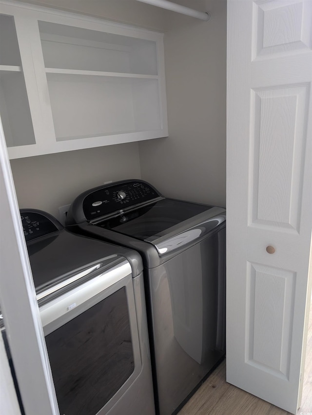 880 Briarwood Dr, Myrtle Beach, SC 29572 - laundry area with separate washer and dryer and light wood-style flooring