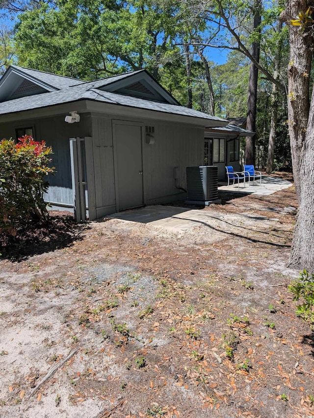 880 Briarwood Dr, Myrtle Beach, SC 29572 - view of home's exterior featuring a patio and roof with shingles