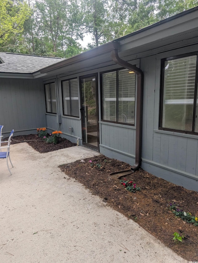 880 Briarwood Dr, Myrtle Beach, SC 29572 - property entrance featuring a patio area and roof with shingles