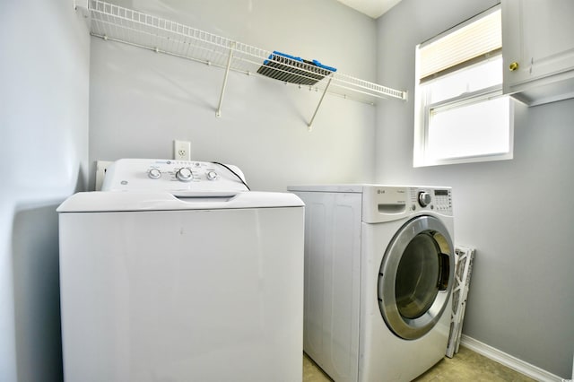 121 Olde Towne Way Unit 2, Myrtle Beach, SC 29588 - laundry room featuring separate washer and dryer, baseboards, and cabinet space