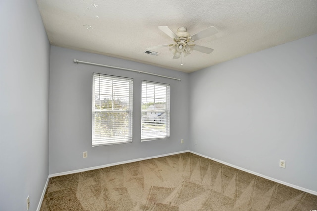 121 Olde Towne Way Unit 2, Myrtle Beach, SC 29588 - spare room with ceiling fan, a textured ceiling, visible vents, carpet floors, and baseboards