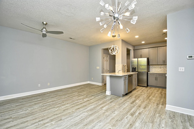 121 Olde Towne Way Unit 2, Myrtle Beach, SC 29588 - kitchen featuring gray cabinetry, appliances with stainless steel finishes, baseboards, and a textured ceiling