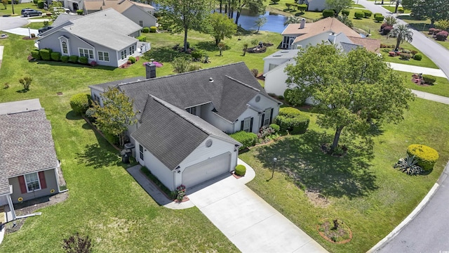 aerial view featuring a water view and a residential view