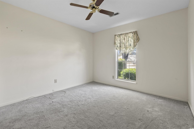 spare room with visible vents, ceiling fan, baseboards, and carpet floors