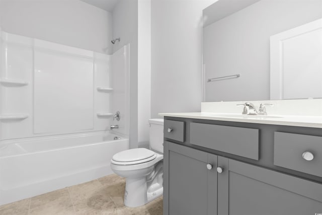 full bathroom featuring toilet, vanity, and  shower combination