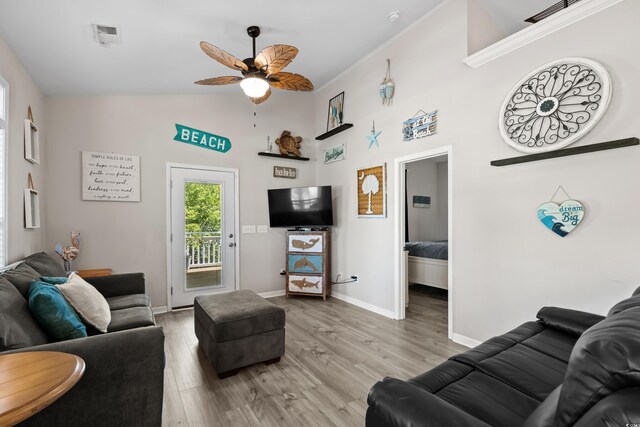 6001-8050 S Kings Hwy, Myrtle Beach, SC 29575 - living room featuring a high ceiling, wood finished floors, visible vents, a ceiling fan, and baseboards