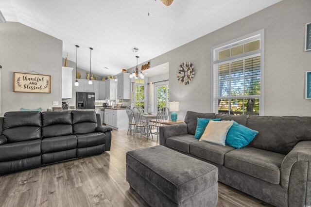 6001-8050 S Kings Hwy, Myrtle Beach, SC 29575 - living area featuring lofted ceiling and wood finished floors