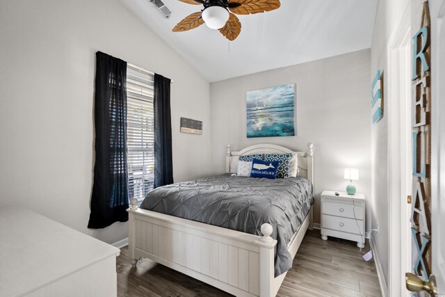 6001-8050 S Kings Hwy, Myrtle Beach, SC 29575 - bedroom featuring lofted ceiling, wood finished floors, visible vents, and baseboards