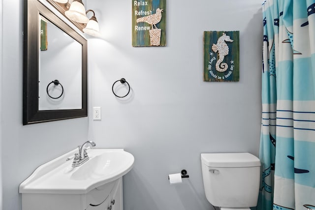 6001-8050 S Kings Hwy, Myrtle Beach, SC 29575 - bathroom featuring toilet, vanity, and curtained shower