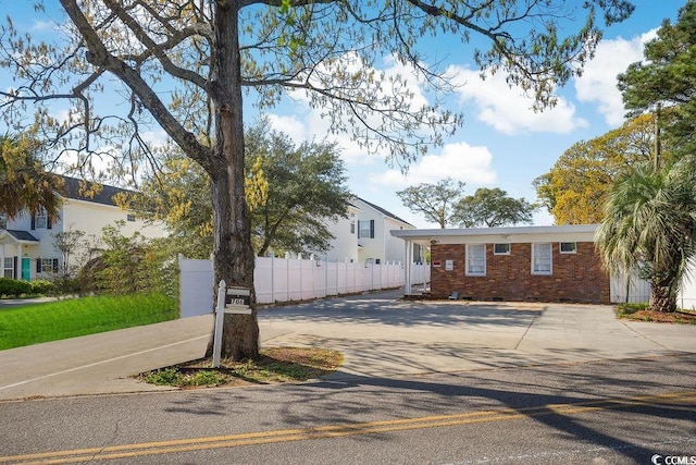 706 Mitchell Dr, Myrtle Beach, SC 29577 - view of front facade with brick siding and concrete driveway