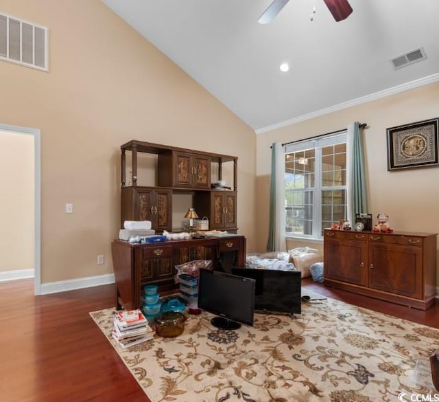 office space with high vaulted ceiling, visible vents, ornamental molding, and wood finished floors