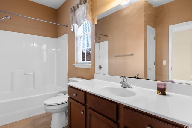 bathroom featuring tile patterned flooring, toilet, shower / bath combination, and vanity