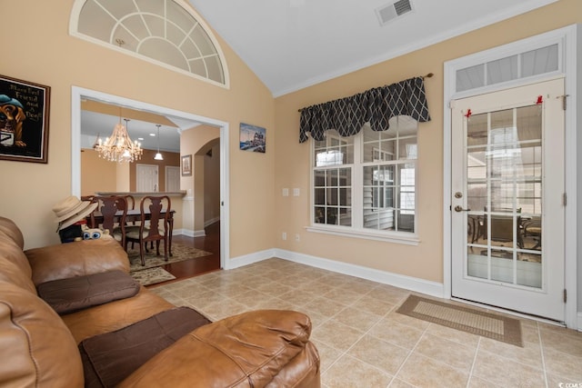 living room featuring crown molding, an inviting chandelier, arched walkways, vaulted ceiling, and visible vents