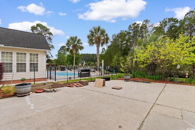 view of pool with a patio, a fenced in pool, and fence