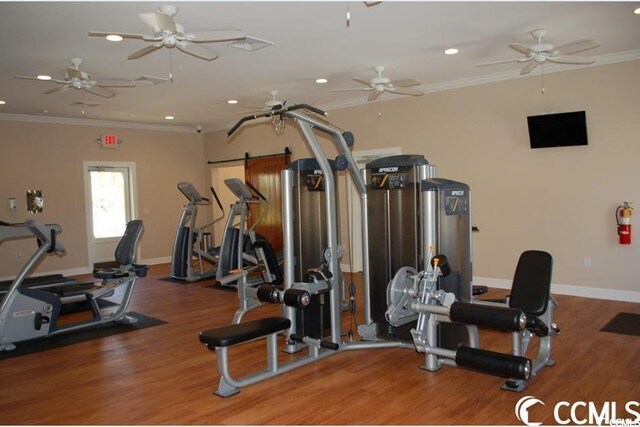 gym featuring recessed lighting, wood finished floors, crown molding, and baseboards