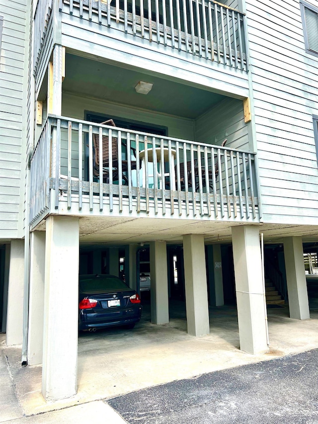 6000 Ocean Blvd N Unit 108, North Myrtle Beach, SC 29582 - view of building exterior with a carport