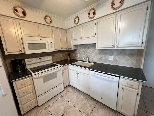 6000 Ocean Blvd N Unit 108, North Myrtle Beach, SC 29582 - kitchen with white appliances, dark countertops, a sink, tasteful backsplash, and crown molding