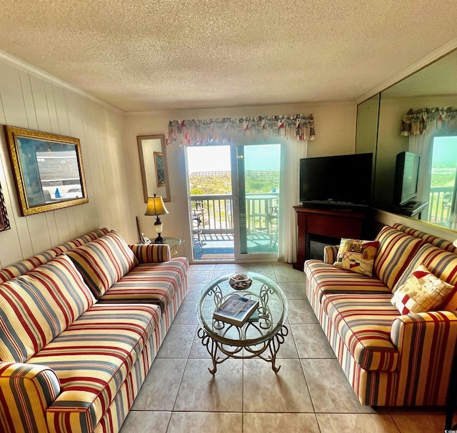 6000 Ocean Blvd N Unit 108, North Myrtle Beach, SC 29582 - tiled living room with ornamental molding, a textured ceiling, a wealth of natural light, and wooden walls