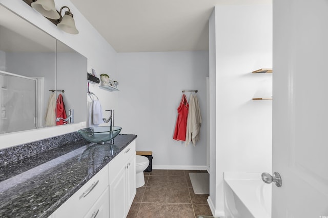 bathroom with a bath, tile patterned floors, toilet, a shower stall, and vanity