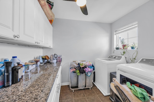 laundry room featuring washer and clothes dryer, ceiling fan, cabinet space, baseboards, and dark tile patterned floors