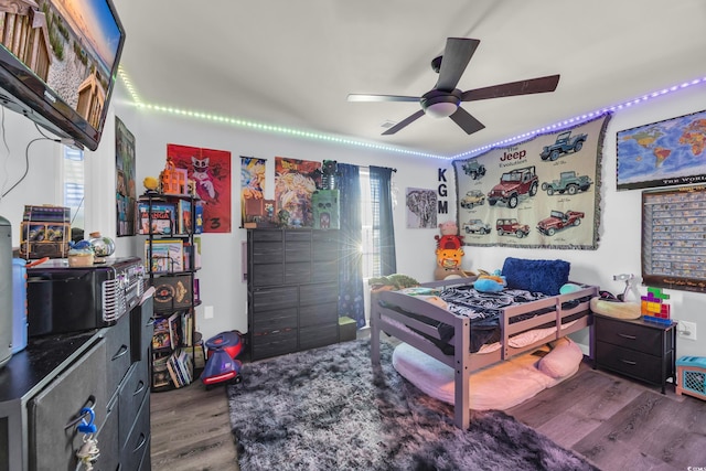 bedroom with wood finished floors and ceiling fan