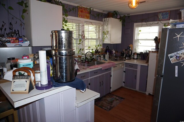 117 Zoe Ct, Longs, SC 29568 - kitchen with light countertops, freestanding refrigerator, dishwasher, a sink, and wood finished floors