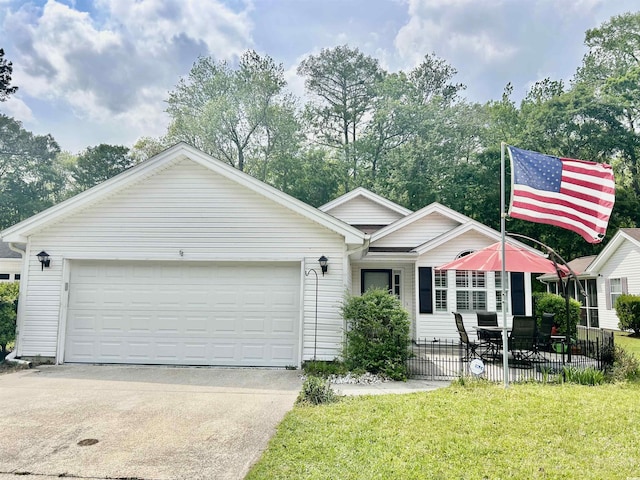 1516 Saint George Ln, Myrtle Beach, SC 29588 - ranch-style house with fence, an attached garage, driveway, and a front yard