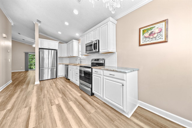1516 Saint George Ln, Myrtle Beach, SC 29588 - kitchen featuring appliances with stainless steel finishes, tasteful backsplash, light wood-type flooring, baseboards, and white cabinets
