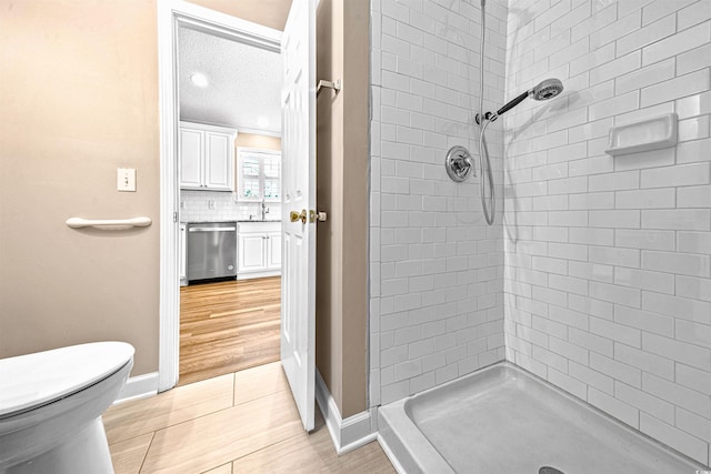 1516 Saint George Ln, Myrtle Beach, SC 29588 - full bath featuring tasteful backsplash, a shower stall, wood finished floors, baseboards, and toilet