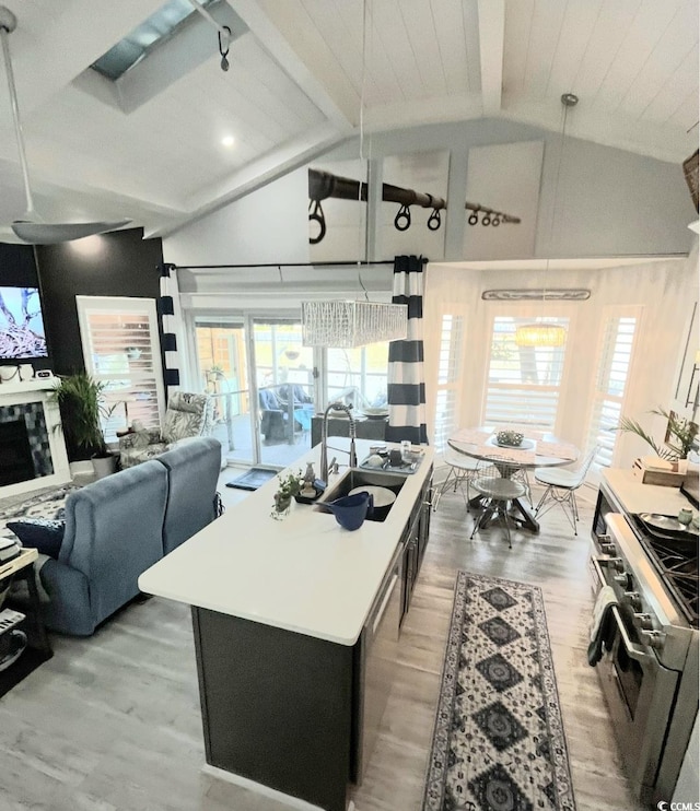 6001-Z55 S Kings Hwy, Myrtle Beach, SC 29575 - kitchen with a sink, open floor plan, beamed ceiling, wood finished floors, and appliances with stainless steel finishes