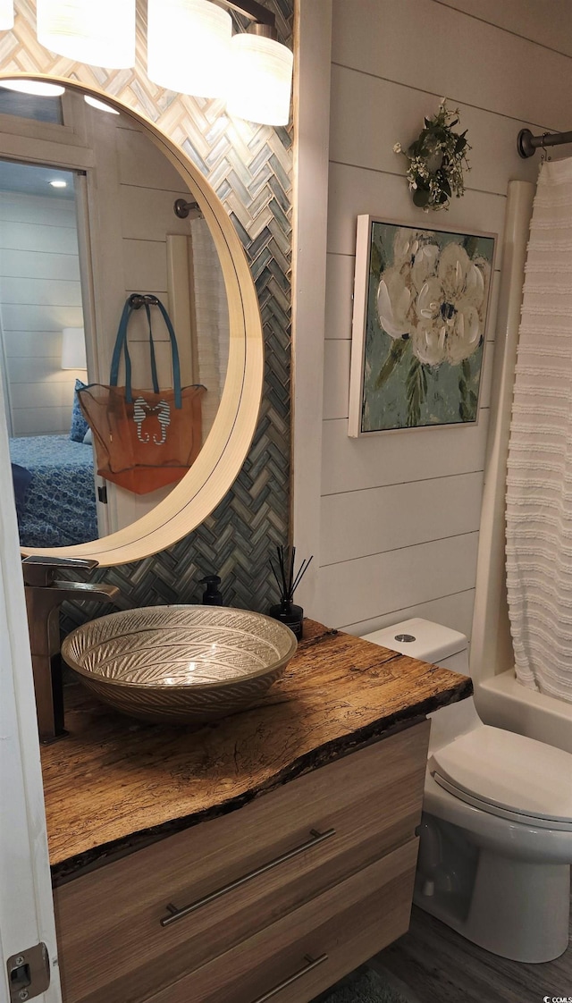 6001-Z55 S Kings Hwy, Myrtle Beach, SC 29575 - bathroom with wood walls, vanity, and toilet