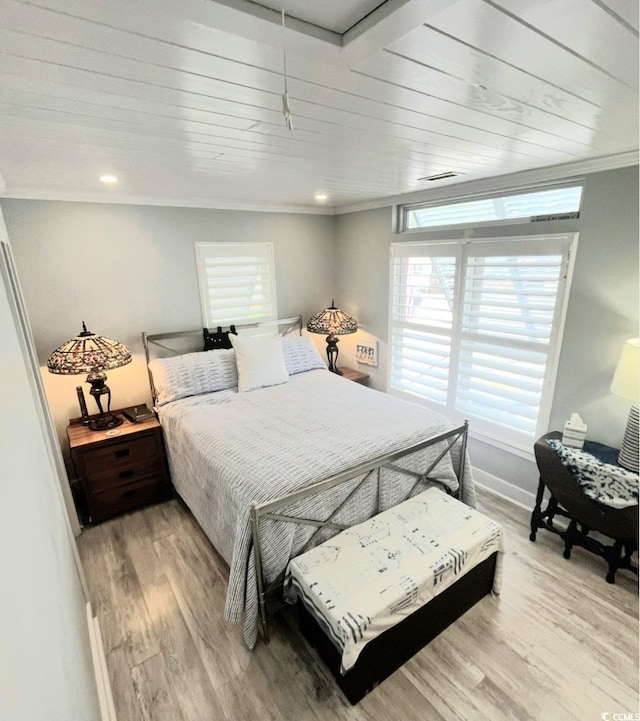 6001-Z55 S Kings Hwy, Myrtle Beach, SC 29575 - bedroom featuring crown molding, visible vents, light wood finished floors, and baseboards
