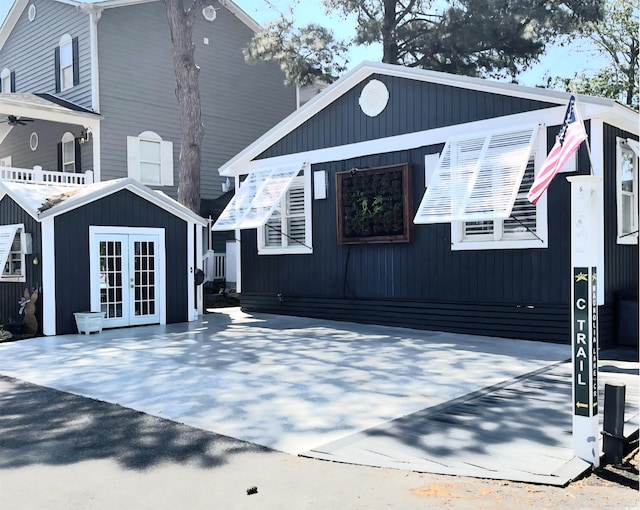 6001-Z55 S Kings Hwy, Myrtle Beach, SC 29575 - view of front of home featuring french doors and an outbuilding