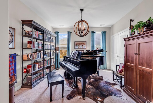 living area with carpet, visible vents, baseboards, and an inviting chandelier