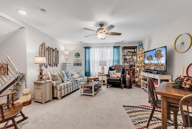 living room featuring ceiling fan and carpet floors
