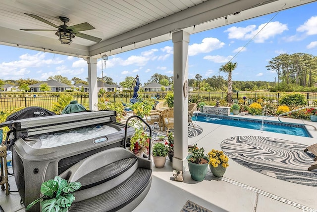 view of patio / terrace with a fenced in pool, a fenced backyard, and a ceiling fan