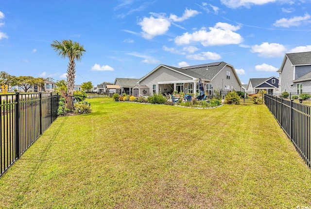view of yard with a fenced backyard