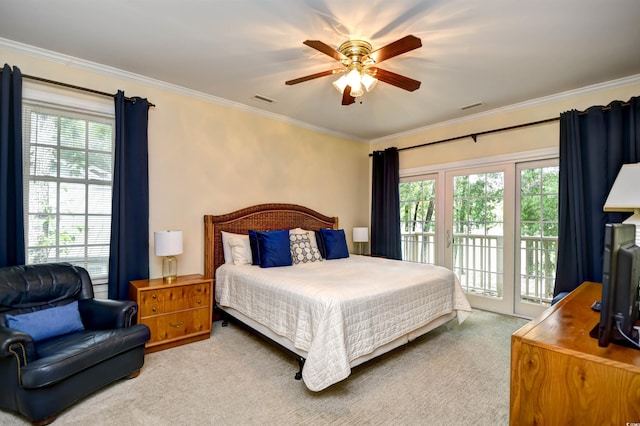 bedroom featuring access to exterior, multiple windows, ornamental molding, and carpet