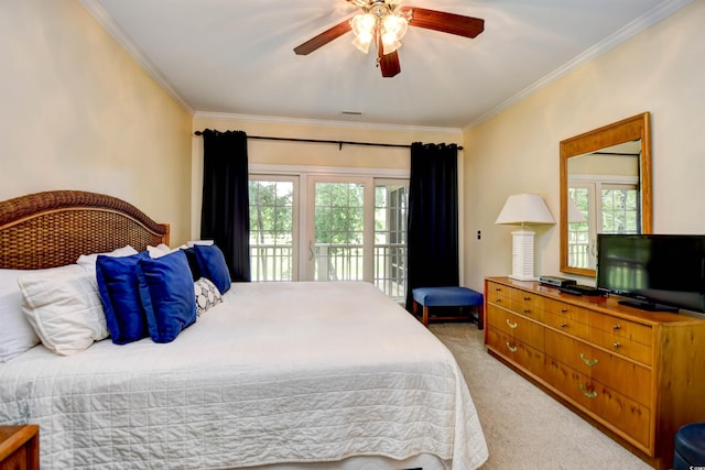 carpeted bedroom featuring ornamental molding, access to exterior, multiple windows, and ceiling fan