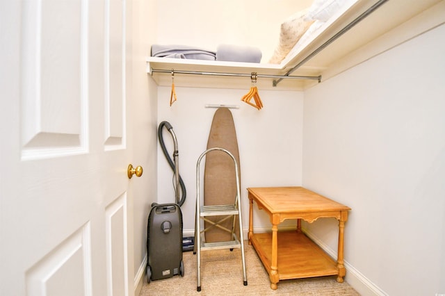 spacious closet with carpet flooring