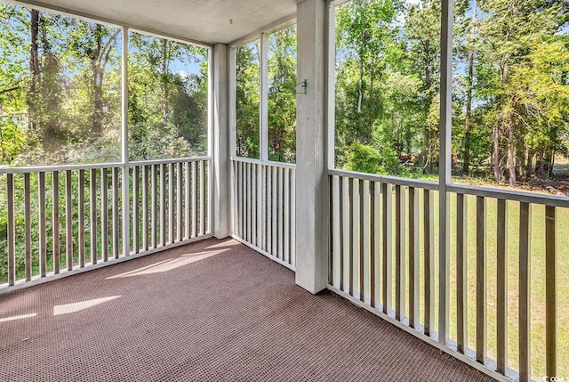 unfurnished sunroom featuring plenty of natural light