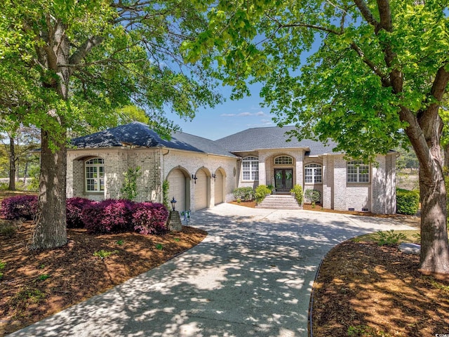 2278 Big Landing Dr, Little River, SC 29566 - view of front of property with roof with shingles, concrete driveway, french doors, brick siding, and a garage