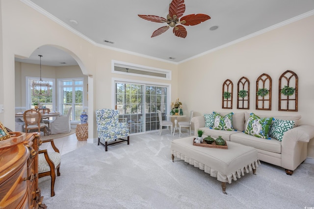 2278 Big Landing Dr, Little River, SC 29566 - living area with arched walkways, visible vents, ornamental molding, and ceiling fan with notable chandelier