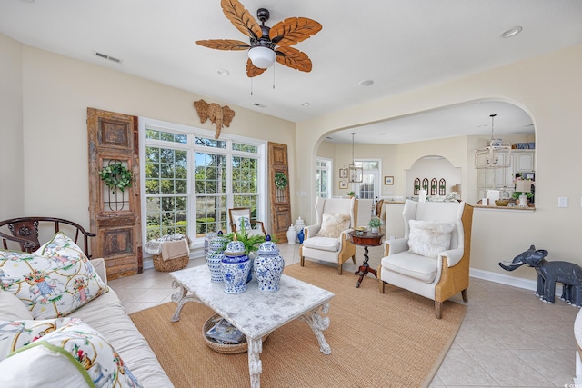 2278 Big Landing Dr, Little River, SC 29566 - living area with arched walkways, visible vents, recessed lighting, ceiling fan, and light tile patterned floors