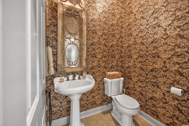 2278 Big Landing Dr, Little River, SC 29566 - bathroom with tile patterned floors, a sink, toilet, baseboards, and wallpapered walls