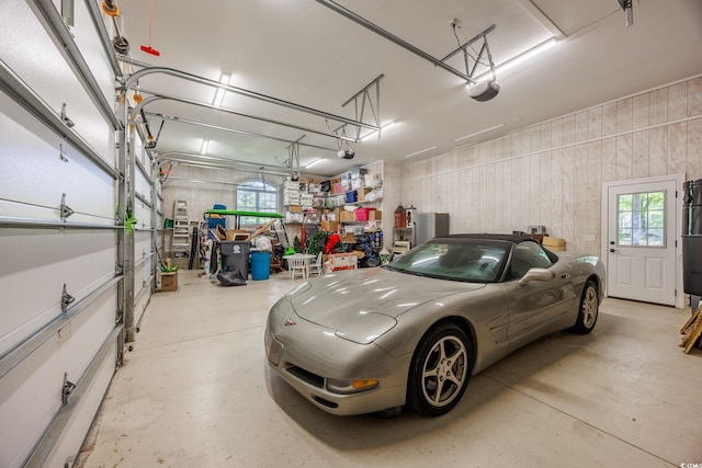 2278 Big Landing Dr, Little River, SC 29566 - garage with wooden walls and a garage door opener