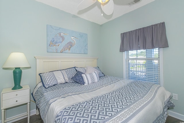 bedroom featuring baseboards, visible vents, and ceiling fan